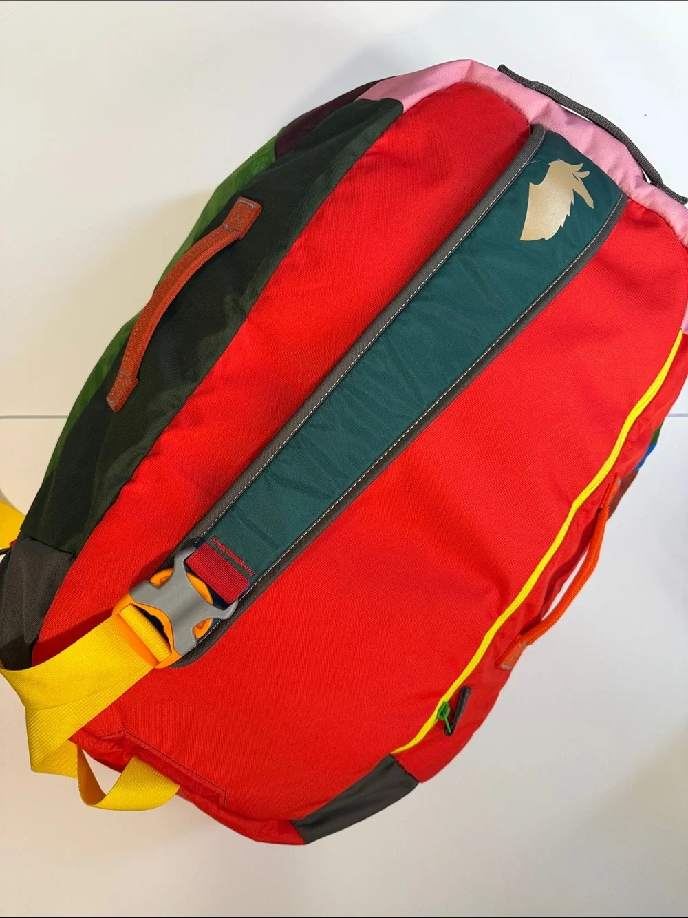 cotopaxi Green Duffel with Orange Logo and Multicolor Panels